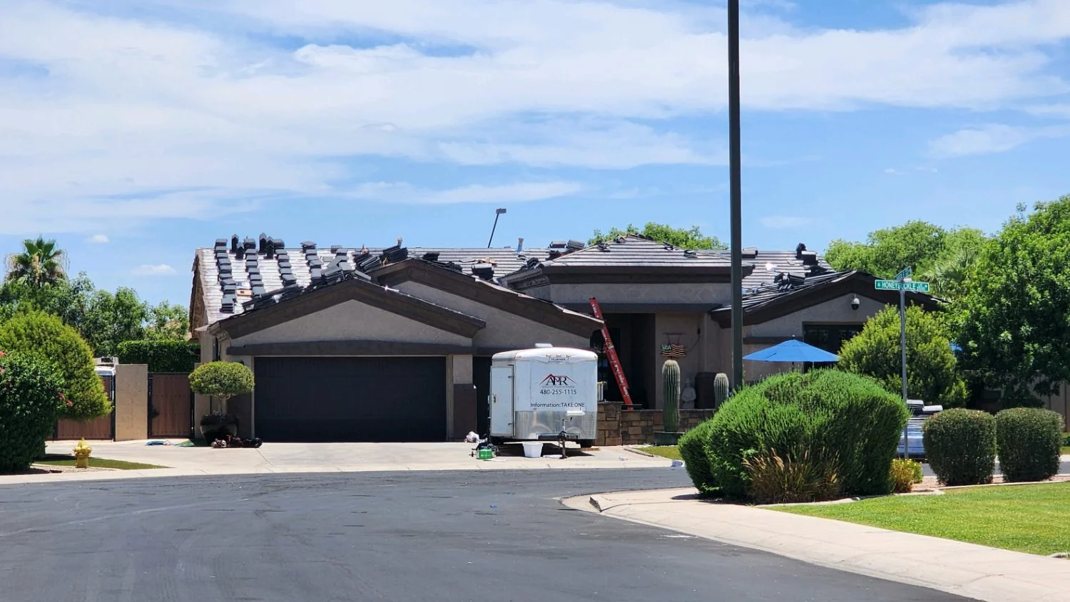 Trailer collecting debris during a residential roof tear-off