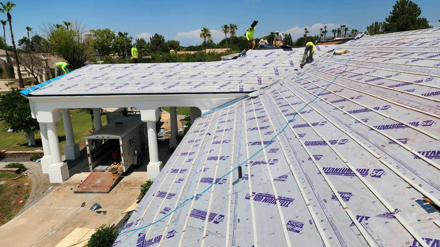 New underlayment installed across a large tile roof